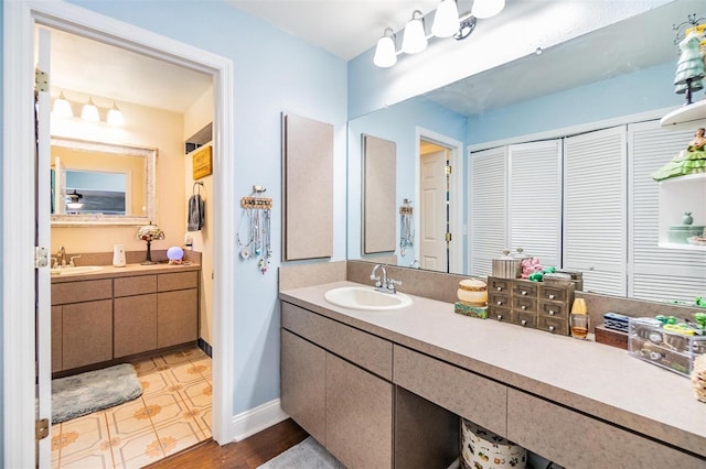 bathroom featuring vanity and wood-type flooring