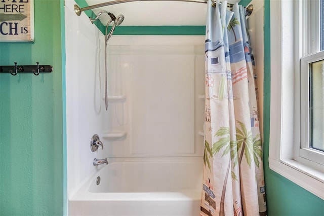 bathroom featuring shower / bathtub combination with curtain