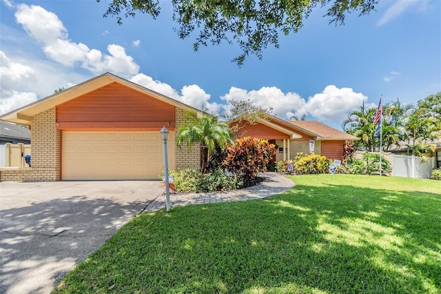 ranch-style house with a garage and a front lawn