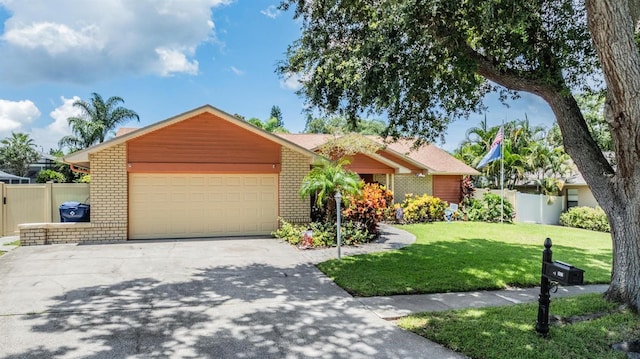 ranch-style house featuring a garage and a front yard