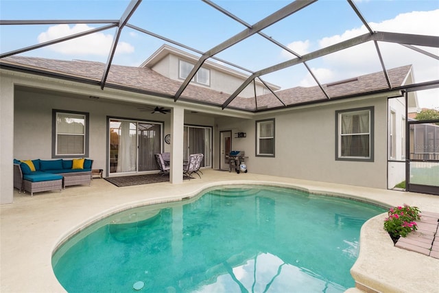 view of swimming pool featuring outdoor lounge area, area for grilling, a lanai, ceiling fan, and a patio area