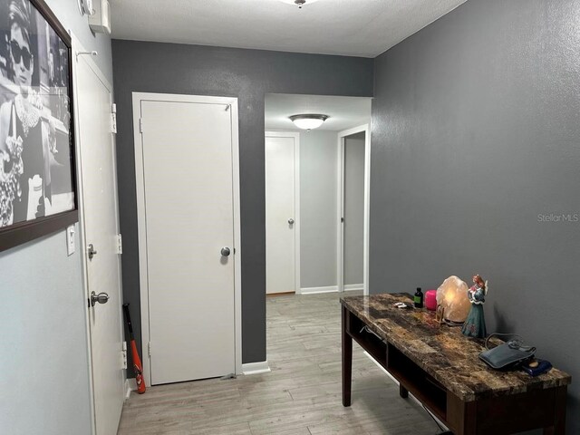 corridor featuring light hardwood / wood-style flooring