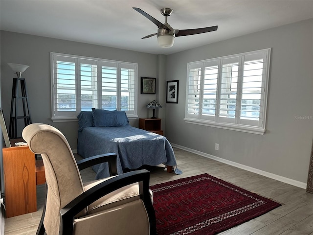 bedroom with ceiling fan and light hardwood / wood-style flooring