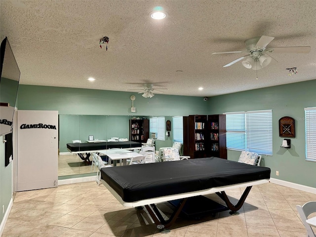 playroom featuring a textured ceiling, billiards, ceiling fan, and light tile patterned flooring