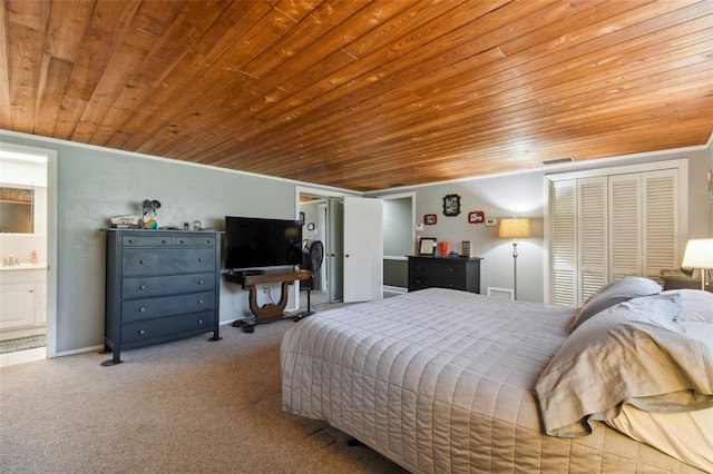 carpeted bedroom featuring connected bathroom, crown molding, a closet, and wooden ceiling