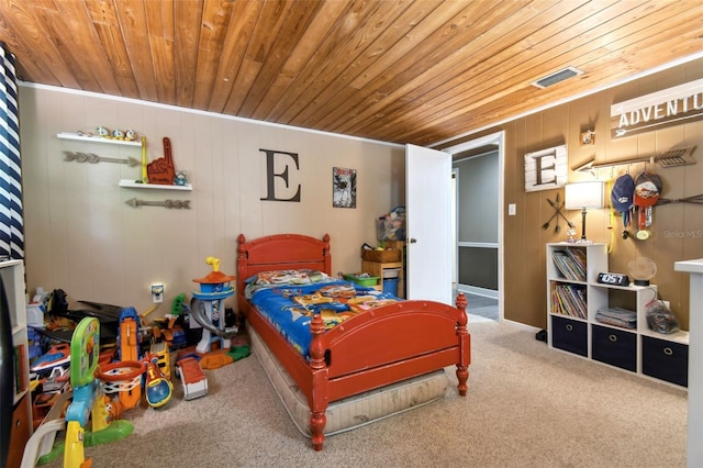 carpeted bedroom featuring wood ceiling