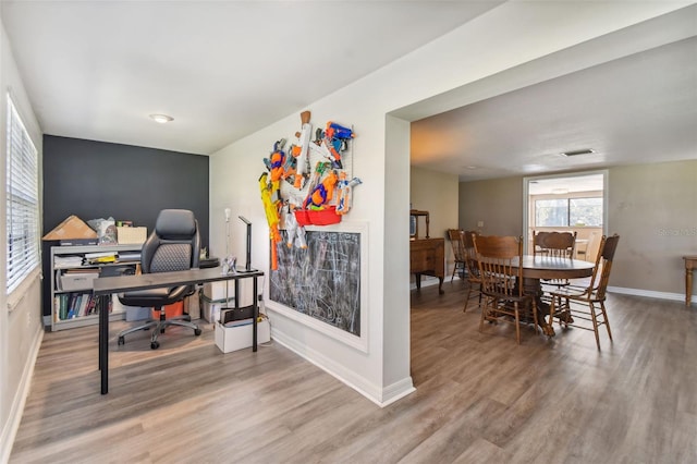 office with wood-type flooring