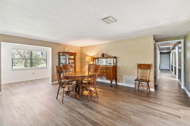 dining area featuring hardwood / wood-style flooring