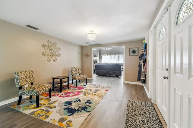 living area featuring hardwood / wood-style floors