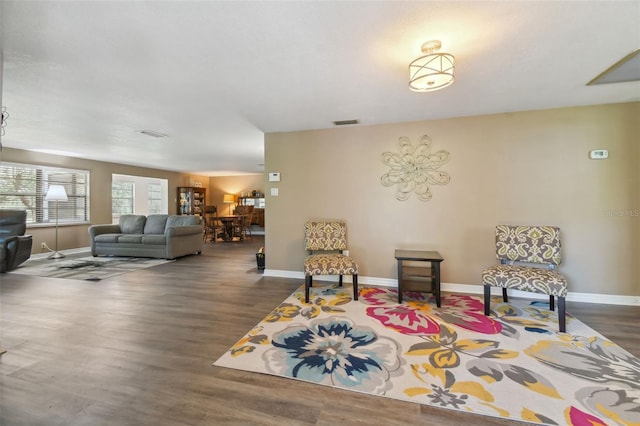 sitting room featuring dark hardwood / wood-style flooring