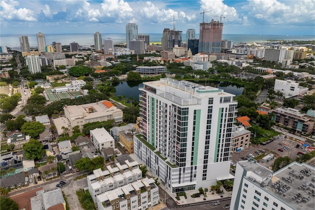 birds eye view of property with a city view and a water view