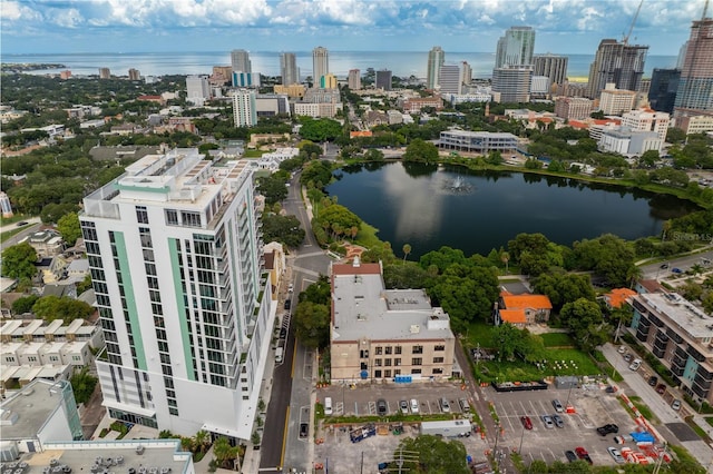 birds eye view of property featuring a water view and a city view
