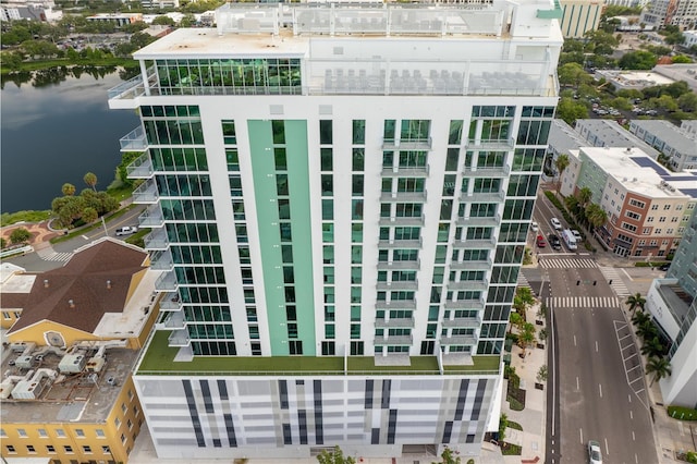 view of property with a city view and a water view