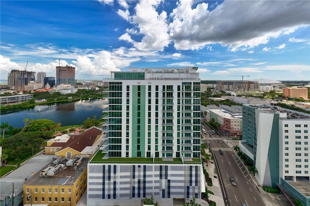 view of building exterior featuring a view of city and a water view