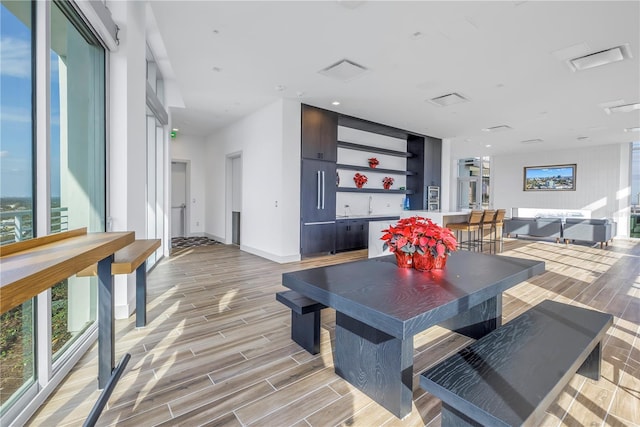 dining room with light wood-type flooring