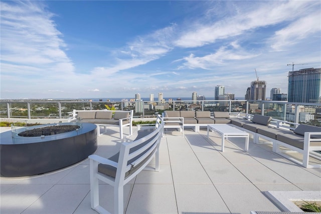 view of patio / terrace featuring an outdoor living space with a fire pit