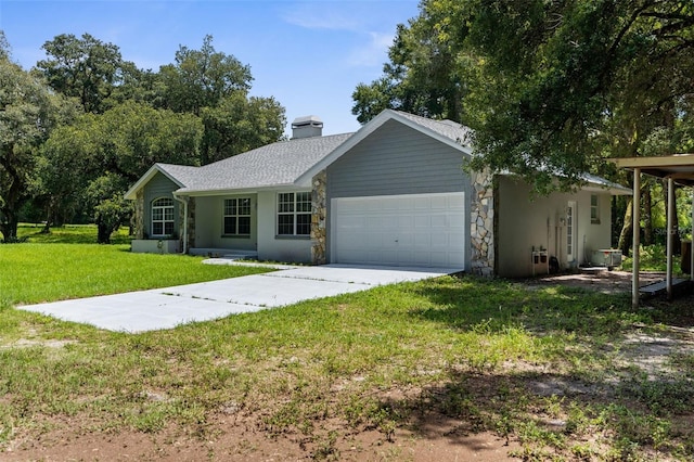 ranch-style house featuring a garage and a front lawn