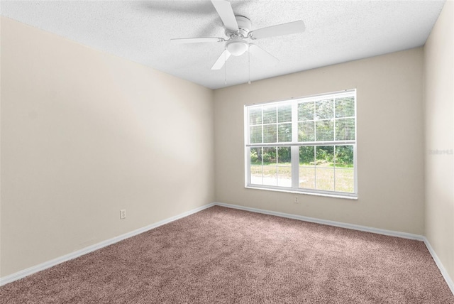 unfurnished room featuring carpet, a textured ceiling, and ceiling fan