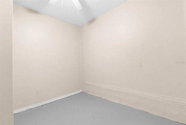 spare room with concrete flooring and ceiling fan