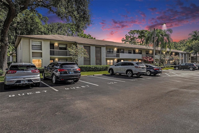 view of parking at dusk