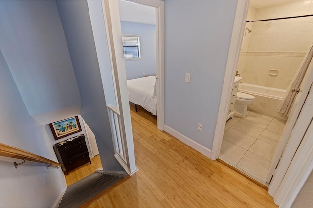 corridor featuring light hardwood / wood-style floors