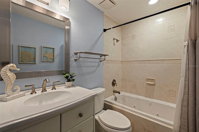 full bathroom with vanity, toilet, shower / bath combination with curtain, and a textured ceiling