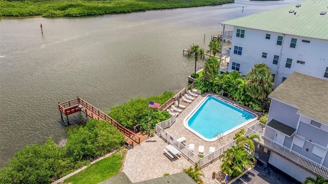 birds eye view of property with a water view