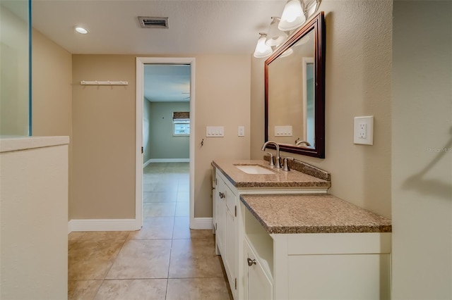 bathroom featuring vanity and tile patterned flooring