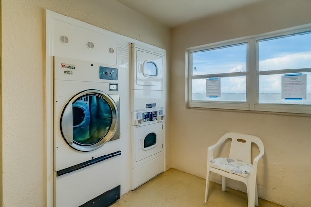 washroom with stacked washer / drying machine