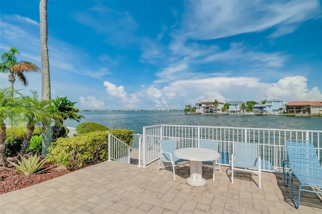 view of patio with a water view