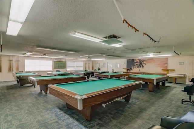 playroom with billiards, a textured ceiling, and carpet