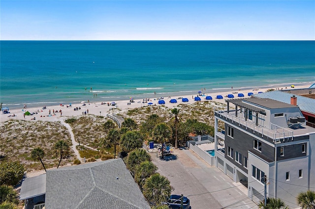 drone / aerial view featuring a view of the beach and a water view