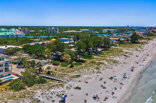 aerial view with a water view and a beach view