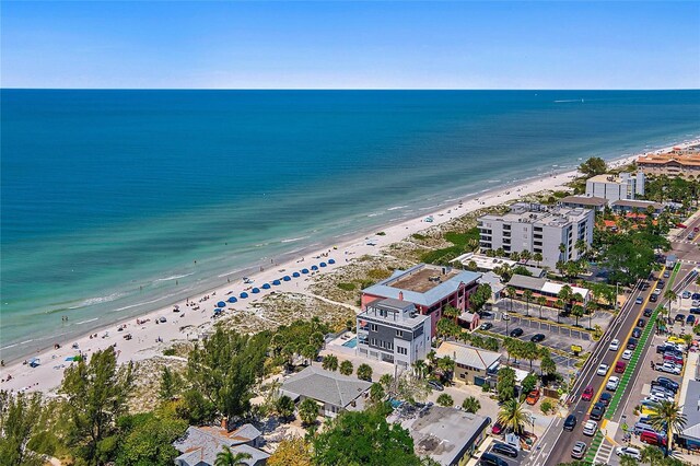 birds eye view of property featuring a water view and a view of the beach