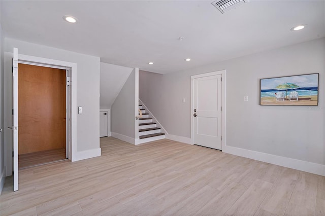 spare room featuring light wood-type flooring