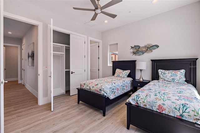 bedroom with ceiling fan, a closet, and light wood-type flooring