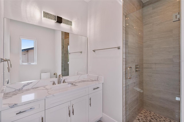 bathroom featuring vanity and walk in shower