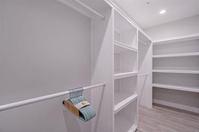 spacious closet with light wood-type flooring