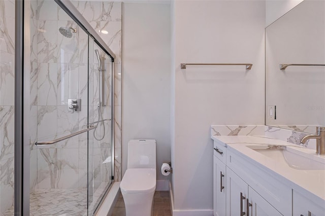 bathroom featuring hardwood / wood-style flooring, vanity, toilet, and an enclosed shower