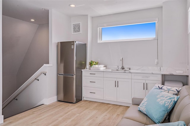 interior space featuring sink and hardwood / wood-style floors