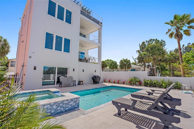 view of pool featuring an in ground hot tub and a patio area