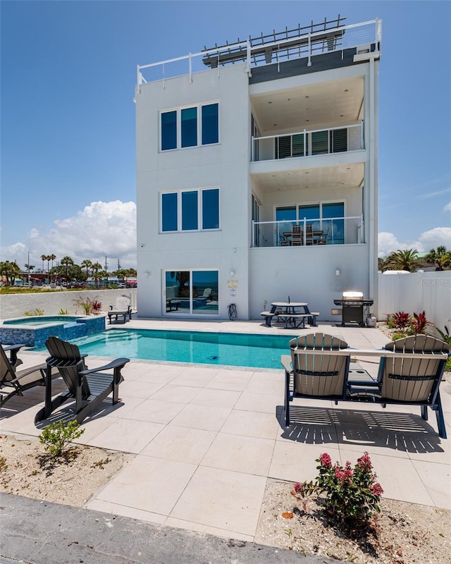 2 4th Ave, Indian Rocks Beach, FL 33785 - view of swimming pool featuring a grill, a patio, and an in-ground hot tub