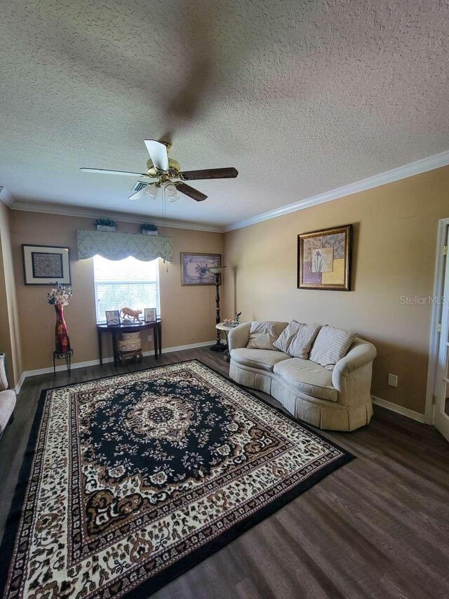 living room featuring a textured ceiling, crown molding, ceiling fan, and dark hardwood / wood-style floors