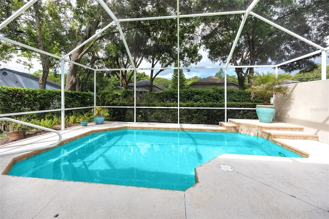 view of pool with a lanai