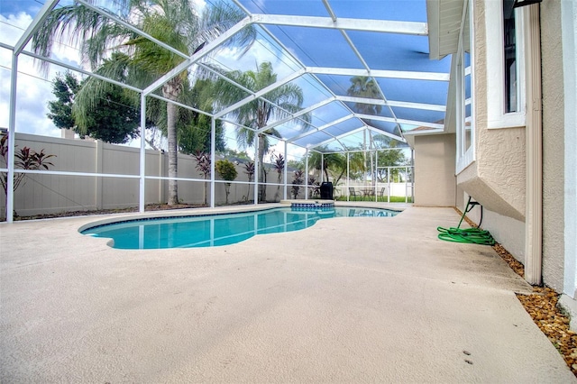 view of pool featuring a patio area and a lanai