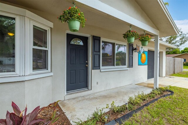 doorway to property featuring a garage