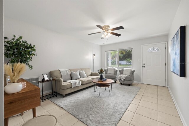 tiled living room featuring ceiling fan