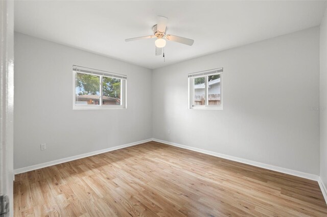 empty room featuring ceiling fan and light wood-type flooring