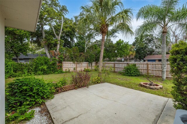 view of patio / terrace featuring an outdoor fire pit