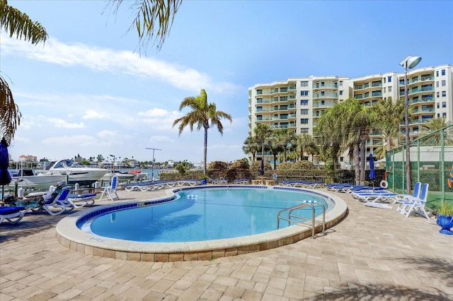 view of swimming pool with a patio